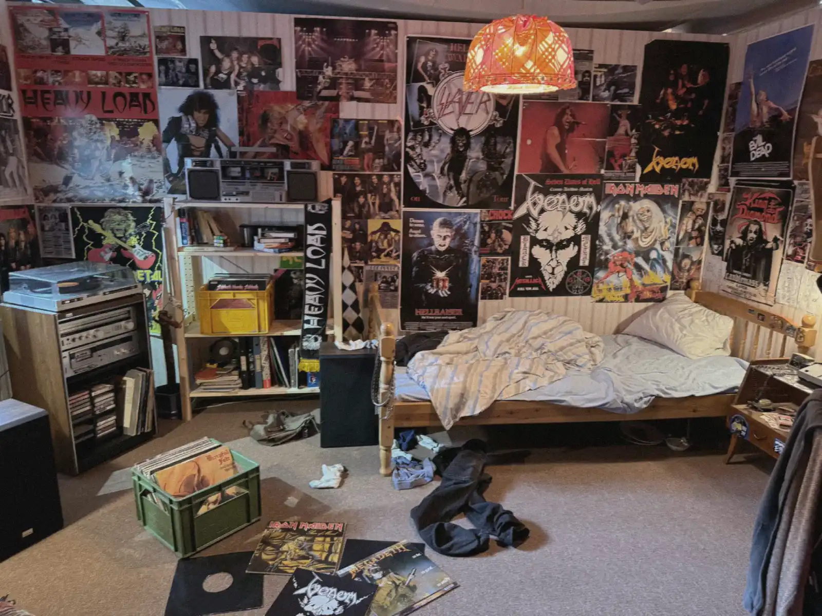messy bedroom with analog equipment and visible signs of daily use